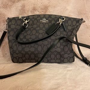 Large zip closure tote bag made by Coach.